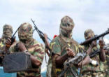 Image of Boko Haram fighters, hiding their identity, as they inflict terror on innocent people in the name of Allah
