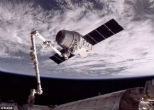 Image of The Dragon capsule captured by the ISS in this NASA photo.