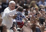 Image of Pope Francis greets the children