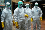 Image of Red Cross workers in Guinea in protective gear. Currently, Guinea, Sierra Leone and Liberia are the worst nations worst hit by the West African Ebola outbreak.