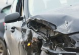 Image of A car accident (not pictured) launched an infant onto the street.