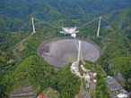 Image of Giant radio telescopes like Arecibo in Puerto Rico could transmit and receive messages from our cosmic backyard.